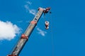 Truck Crane Boom With Hooks And Scale Weight Above Blue Sky