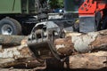 Truck crane hold wood. Wood chipper shredder. A harvester is a type of heavy forestry vehicle employed in cut-to-length logging Royalty Free Stock Photo