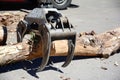 Truck crane hold wood. Wood chipper shredder. A harvester is a type of heavy forestry vehicle employed in cut-to-length logging Royalty Free Stock Photo