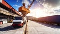 Truck and crane loading cargo containers at a busy port under a sunny sky Royalty Free Stock Photo