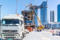 Truck and cranes in a Construction site - building skyscraper under construction