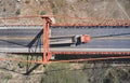 Truck crosses beautiful bridge in summer. Scene. Aerial view of truck carrying things driving across bridge on background