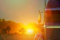 Truck dashboard with on the countryside road in motion against with sunset