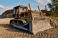 truck digging ground for construction excavator gravel sand trees blue sky Royalty Free Stock Photo