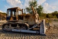 truck digging ground for construction excavator gravel sand trees blue sky Royalty Free Stock Photo