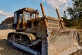 truck digging ground for construction excavator gravel sand trees blue sky Royalty Free Stock Photo