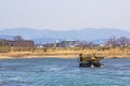 Truck and Dredging stone in river Katsura for to make water flow It`s easy in Kyoto.