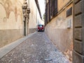 Truck drive on narrow medieval street in Bergamo
