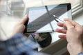 Truck driver checking electronic logbooks on a tablet