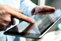 Truck driver checking electronic logbooks on a tablet