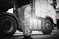 Truck Driver is Checking the Truck`s Safety Maintenance Checklist. Inspection Safety of Semi Truck Wheels Tires. Royalty Free Stock Photo