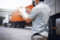 Truck Driver is Checking the Truck`s Safety Maintenance Checklist. Lorry. Inspection Semi Truck Wheels and Tires. Shipping Trucks Royalty Free Stock Photo