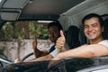 Ethnically diverse mover team driving a truck for relocation service