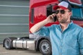 Truck Driver Ordering New Tractor Parts by Phone Royalty Free Stock Photo