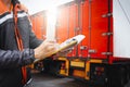 Truck Drivers Hold a Clipboard The Checking Container Door. Cargo Shipping. Load Trucks. Shipment Truck Logistic Transport.