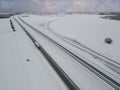 A truck drives along the highway leading to Tallinn in winter, photo from a drone