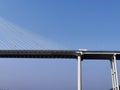 Truck driving across the Chongqing Bridge against a clear blue sky in Chongqing, China. Royalty Free Stock Photo