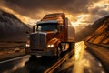Truck driving on the asphalt road in rural landscape at sunset with dark clouds. Cargo, goods transportation concept
