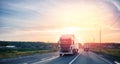 Truck driving on asphalt road in rural russia landscape with sun light, concept cargo transportation. Blur move effect