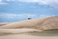 A truck driving in the back of a unique white sand dunes of Lencois Maranhenses in north Brazil Royalty Free Stock Photo