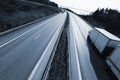 Truck driving on freeway at dusk Royalty Free Stock Photo