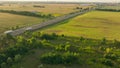 Truck driving highway sun sunset road transport forest field aerial