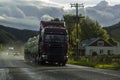 Truck driving on rainy day in rural landscape Royalty Free Stock Photo