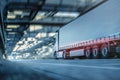 Truck driving on a road through an industrial style tunnel