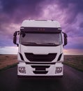 Truck Driving on Road at Sunset Royalty Free Stock Photo