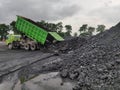 The truck dumping coal at stockpile