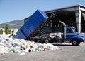 Truck dumping recyclable paper and plastic
