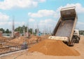 Truck dumping and tipping sand for new building Royalty Free Stock Photo