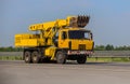 Truck Excavator Drives on Road