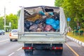 Truck with garbage bags in the back. Cleaning and transportation of household waste