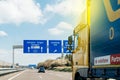 Truck on German autobahn higway in front of street signs Royalty Free Stock Photo