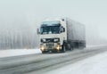 truck goes on winter road Royalty Free Stock Photo