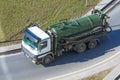 Truck with green tank for pumping waste or contaminated water