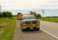 A truck guiding an oversize load