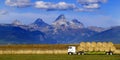 Truck Hauling Hay with Teton Mountains in Background Farming Operation