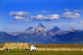 Truck Hauling Hay with Teton Mountains in Background