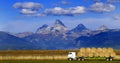 Truck Hauling Hay with Teton Mountains in Background