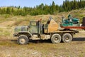 A truck hauling materials needed for mining gold at otter creek, bc,