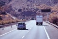 Truck on a highway - back view, tunnel through mountain