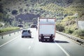 Truck on a highway - back view, tunnel through mountain