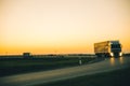 Truck on highway on sunset