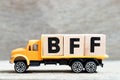 Truck hold block in word BFF Abbreviation of best friend forever on wood background