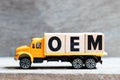 Truck hold block in word OEM Abbbreviation of Original Equipment Manufacturer on wood background