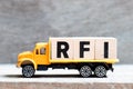 Truck hold block in word RFI Abbreviation of request for information on wood background