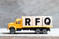 Truck hold block in word RFQ Abbreviation of request for quotation on wood background