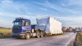 Truck with large oversized cargo on rural road Royalty Free Stock Photo